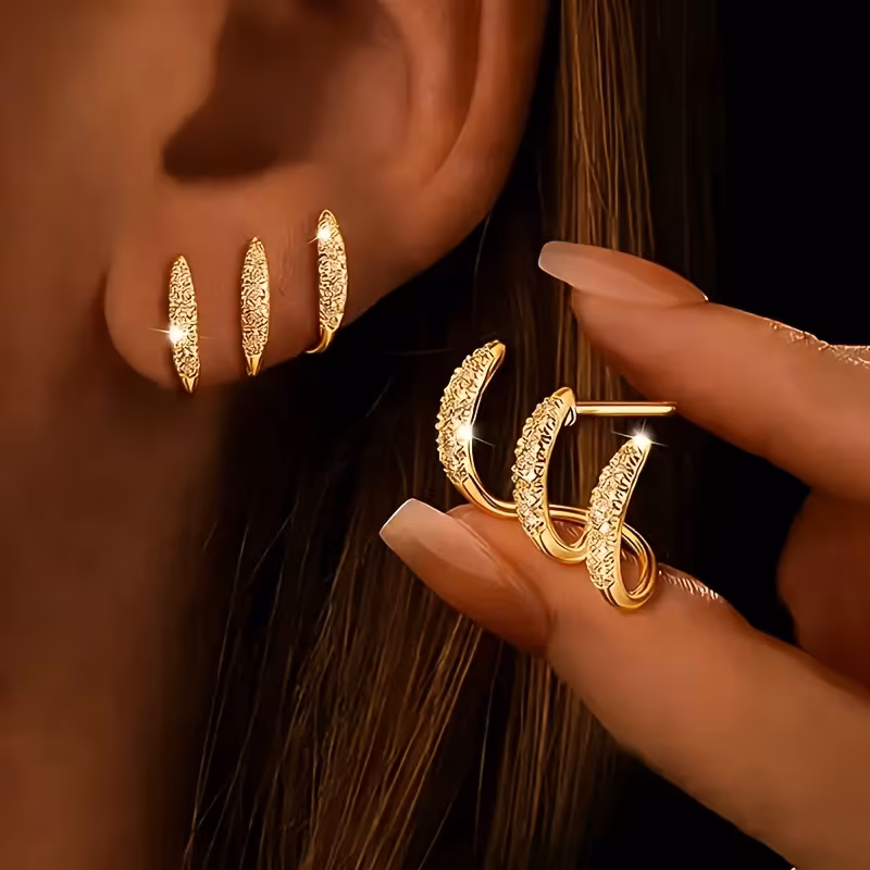 Aretes curvos 3 garras con cristales